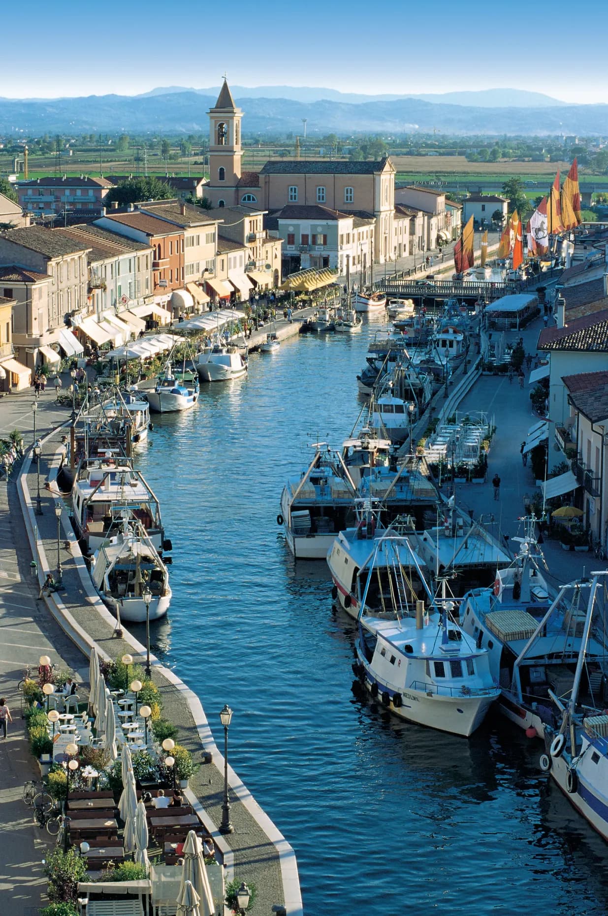 Aerial view of Cesenatico's canal port, lined with fishing boats and lugger sails